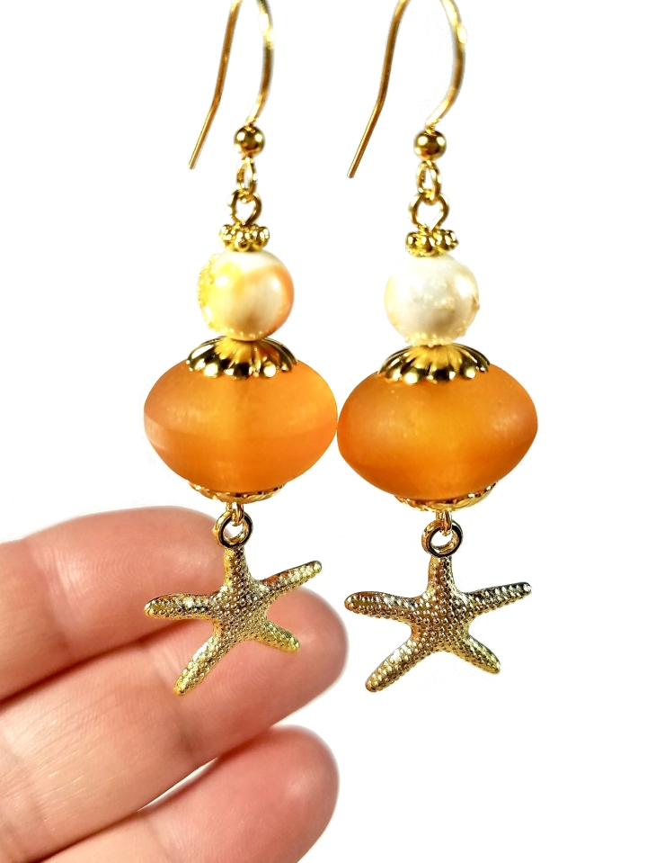 orange starfish dangle earrings