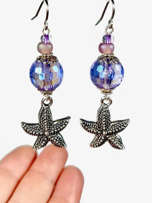 purple starfish dangle earrings